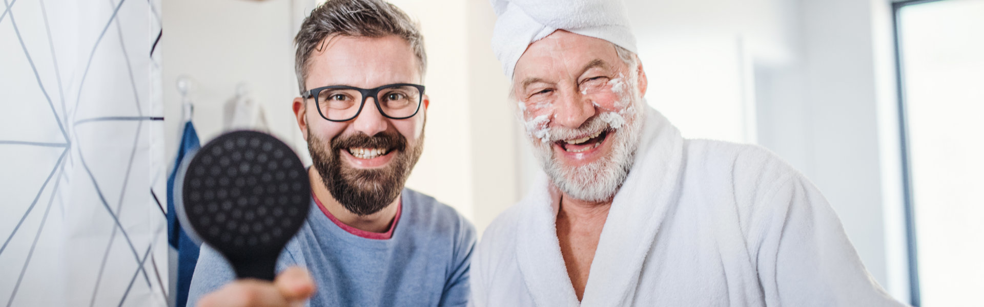 aide and elderly man smiling