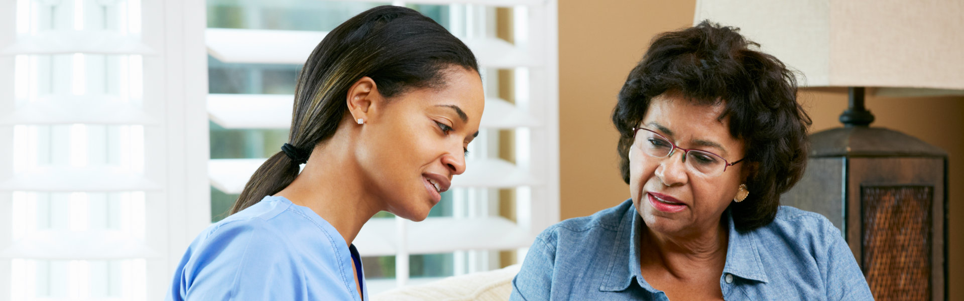 nurse and woman talking